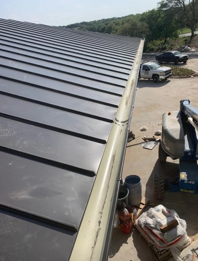 Standing seam panel and gutter detail on a metal roofing jobsite in The Village of Indian Hill